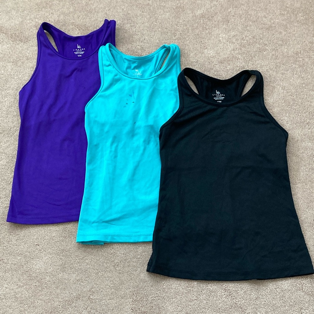 Girls tank tops. Will send 3. Purple, teal and black. Dance and gymnastics. YM